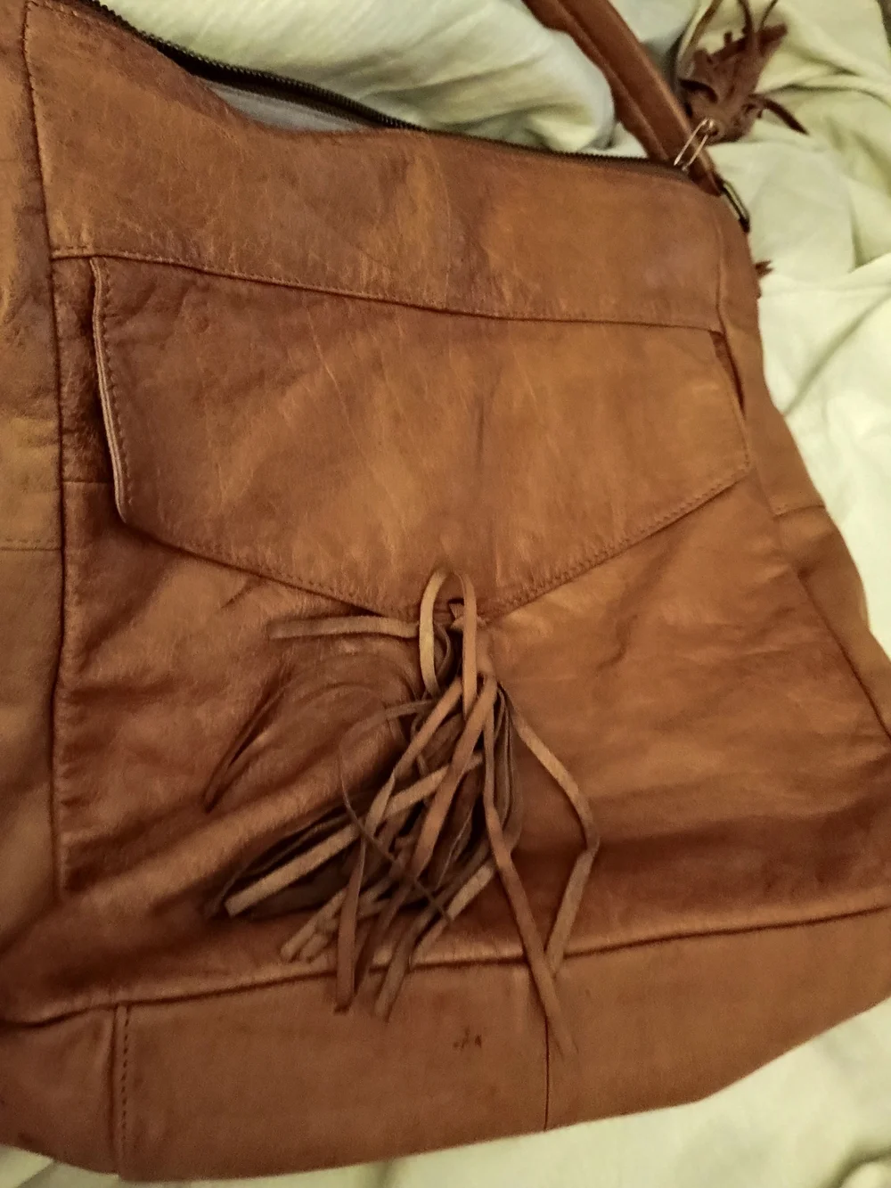 ANTHROPOLOGIE!! LEATHER TAN W/TASSELS!! 14 IN X 14 IN
